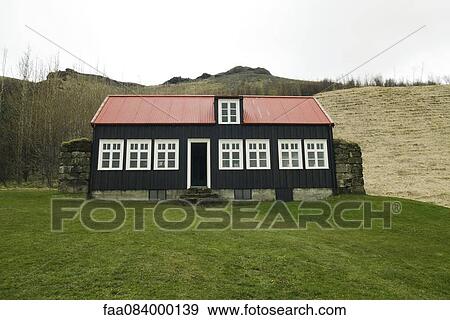 Stock Photo - Typical Icelandic house with red roof, Iceland. Fotosearch