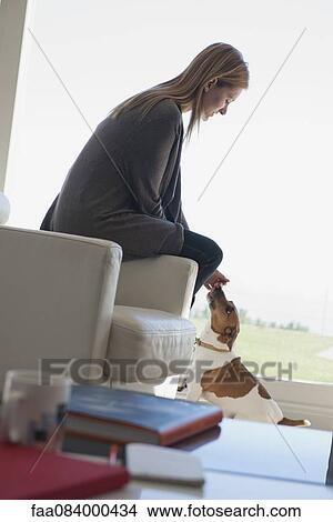 Woman petting dog View Large Photo Image Picture - Woman petting dog. Fotosearch
