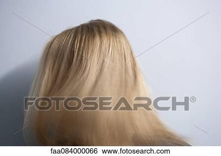 Woman tossing blonde hair View Large Photo Image Stock Photograph - Woman tossing blonde hair. Fotosearch