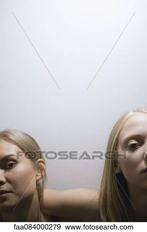 Stock Photo - Young female friends, cropped portrait. Fotosearch
