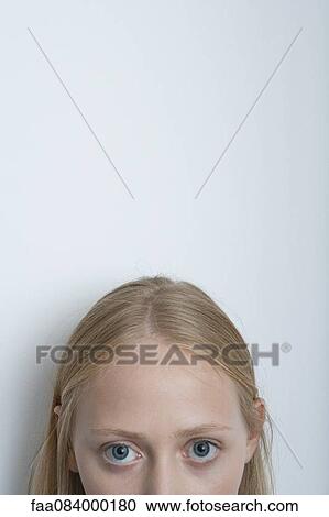 Stock Image - Young woman, cropped portrait. Fotosearch