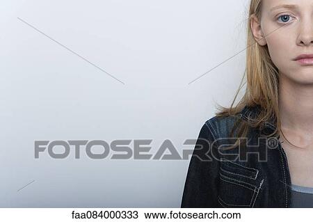 Stock Image - Young woman, cropped portrait. Fotosearch