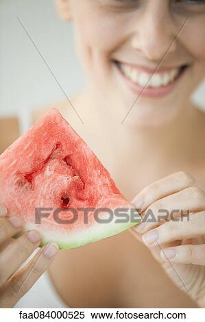 Young woman eating watermelon View Large Photo Image Stock Photography - Young woman eating watermelon. Fotosearch