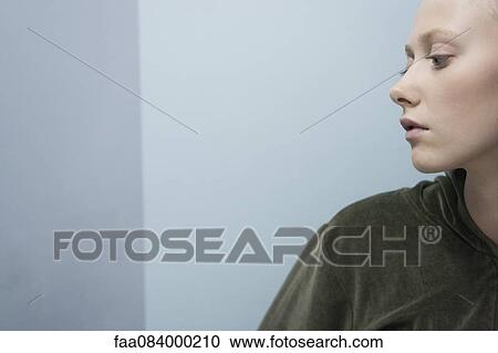 Young woman in profile, portrait View Large Photo Image Stock Image - Young woman in profile, portrait. Fotosearch