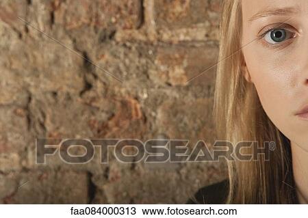 Young woman looking at camera, cropped View Large Photo Image Stock Image - Young woman looking at camera, cropped. Fotosearch