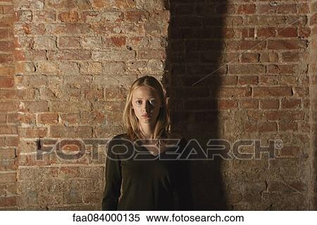 Young woman looking at camera, portrait View Large Photo Image Stock Photography - Young woman looking at camera, portrait. Fotosearch