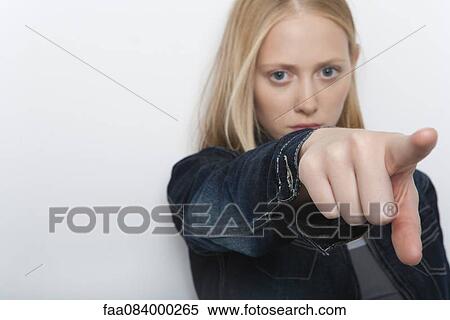 Young woman pointing finger accuslingly View Large Photo Image Stock Photography - Young woman pointing finger accuslingly. Fotosearch
