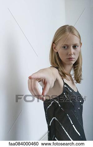 Young woman pointing finger View Large Photo Image Stock Image - Young woman pointing finger. Fotosearch