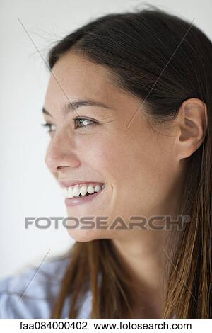 Young woman smiling, profile View Large Photo Image Stock Image - Young woman smiling, profile. Fotosearch