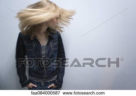 Stock Photo - Young woman tossing hair. Fotosearch