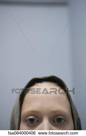 Young woman wearing hood, cropped portrait View Large Photo Image Stock Photograph - Young woman wearing hood, cropped portrait. Fotosearch