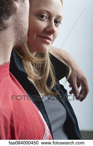 Young woman with boyfriend, portrait View Large Photo Image Stock Image - Young woman with boyfriend, portrait. Fotosearch