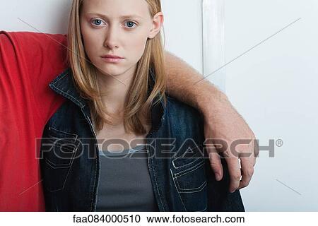 Stock Image - Young woman with boyfriend, portrait. Fotosearch