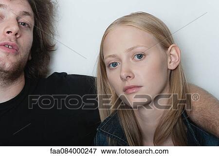 Stock Photo - Young woman with boyfriend, portrait. Fotosearch
