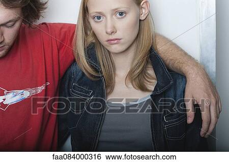 Young woman with boyfriend, portrait View Large Photo Image Stock Photograph - Young woman with boyfriend, portrait. Fotosearch