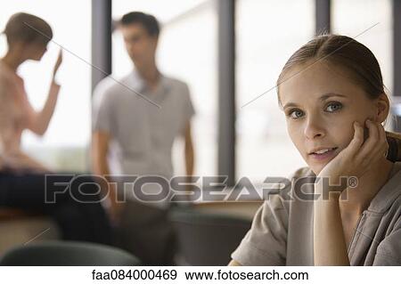 Young woman with hand under chin, portrait View Large Photo Image Stock Photo - Young woman with hand under chin, portrait. Fotosearch