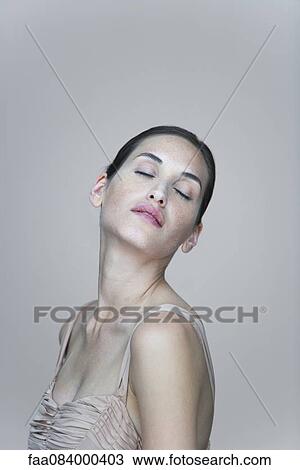 Young woman with head back and eyes closed, portrait View Large Photo Image Stock Image - Young woman with head back and eyes closed, portrait. Fotosearch
