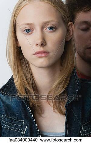 Young woman with unhappy expression, portrait View Large Photo Image Stock Image - Young woman with unhappy expression, portrait. Fotosearch