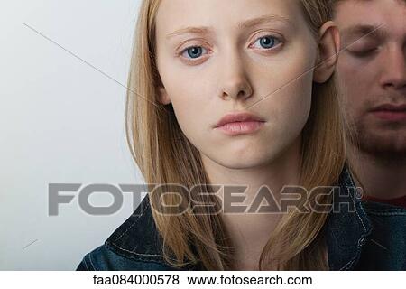 Young woman with unhappy expression, portrait View Large Photo Image Stock Photo - Young woman with unhappy expression, portrait. Fotosearch