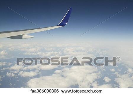 Stock Photograph - Aerial view aboard a passenger aircraft. Fotosearch
