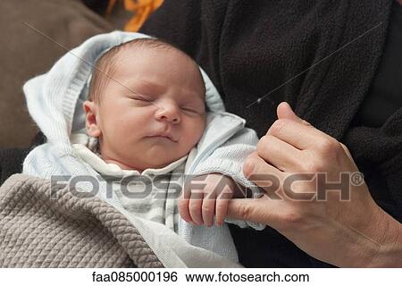 Baby holding adult's finger View Large Photo Image Stock Photograph - Baby holding adult's finger. Fotosearch