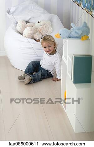Stock Image - Baby playing in nursery. Fotosearch