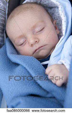 Baby sleeping in blanket View Large Photo Image Stock Photograph - Baby sleeping in blanket. Fotosearch