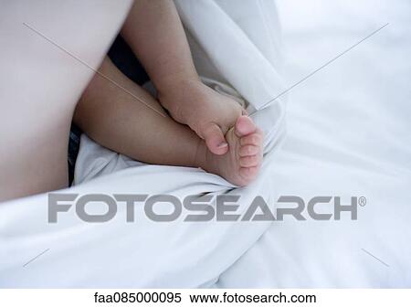 Stock Photography - Baby's barefeet, cropped. Fotosearch