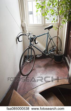 Stock Photo - Bicycle parked in corridor. Fotosearch