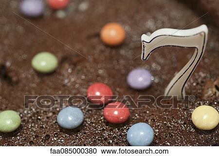 Stock Image - Birthday cake with candle. Fotosearch