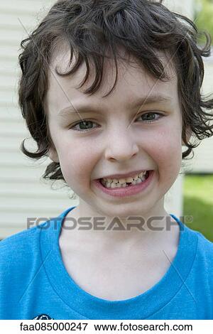 Stock Photo - Boy smiling, portrait. Fotosearch