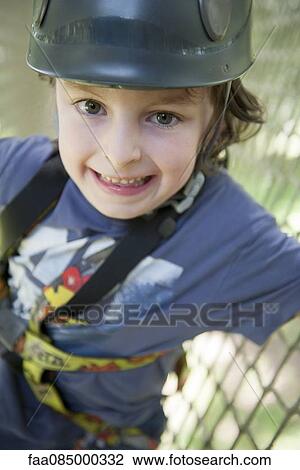 Boy wearing helmet, smiling View Large Photo Image Stock Image - Boy wearing helmet, smiling. Fotosearch