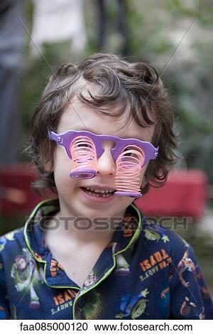 Boy wearing novelty glasses View Large Photo Image Stock Image - Boy wearing novelty glasses. Fotosearch