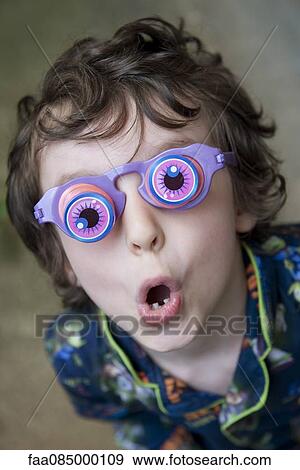 Stock Photo - Boy wearing novelty glasses. Fotosearch