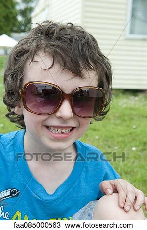 Boy wearing sunglasses, portrait View Large Photo Image Stock Image - Boy wearing sunglasses, portrait. Fotosearch