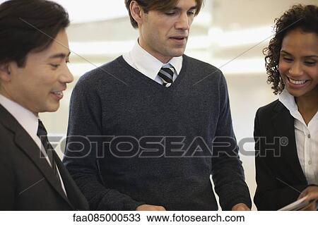 Business colleagues collaborating View Large Photo Image Stock Image - Business colleagues collaborating. Fotosearch