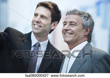 Business partners smiling outdoors, portrait View Large Photo Image Stock Photo - Business partners smiling outdoors, portrait. Fotosearch