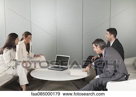 Stock Photo - Business people in meeting. Fotosearch