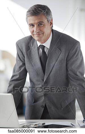 Businessman in office, portrait View Large Photo Image Stock Image - Businessman in office, portrait. Fotosearch