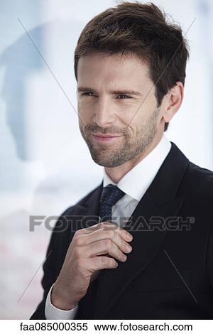 Businessman looking away, smiling, portrait View Large Photo Image Stock Photography - Businessman looking away, smiling, portrait. Fotosearch