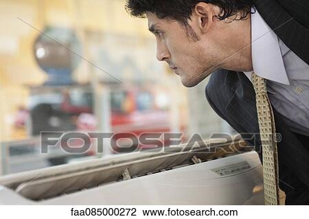 Businessman looking out of window View Large Photo Image Stock Image - Businessman looking out of window. Fotosearch