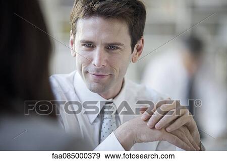 Businessman meeting with client View Large Photo Image Stock Photo - Businessman meeting with client. Fotosearch