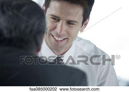 Businessman meeting with colleague View Large Photo Image Stock Image - Businessman meeting with colleague. Fotosearch