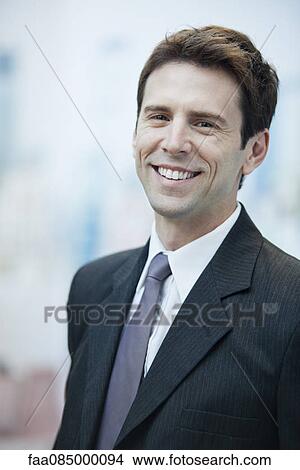 Businessman smiling cheerfully, portrait View Large Photo Image Picture - Businessman smiling cheerfully, portrait. Fotosearch