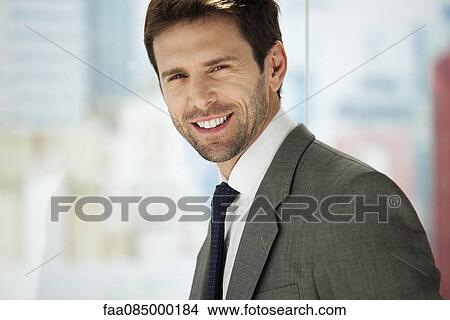 Businessman smiling, portrait View Large Photo Image Picture - Businessman smiling, portrait. Fotosearch