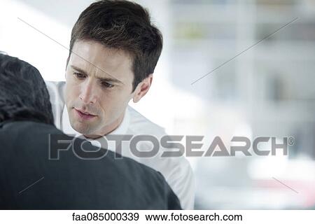 Businessmen discussing work View Large Photo Image Stock Photo - Businessmen discussing work. Fotosearch