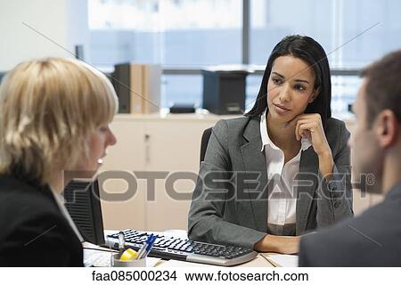 Picture - Businesswoman meeting with business partners in office. Fotosearch