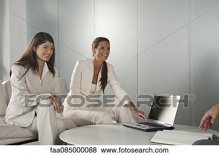Businesswomen in meeting View Large Photo Image Stock Photo - Businesswomen in meeting. Fotosearch