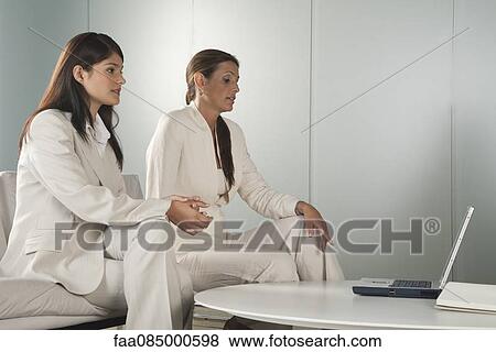 Stock Photo - Businesswomen in meeting. Fotosearch