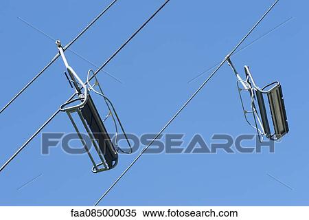Stock Photography - Chairlifts, low angle view. Fotosearch